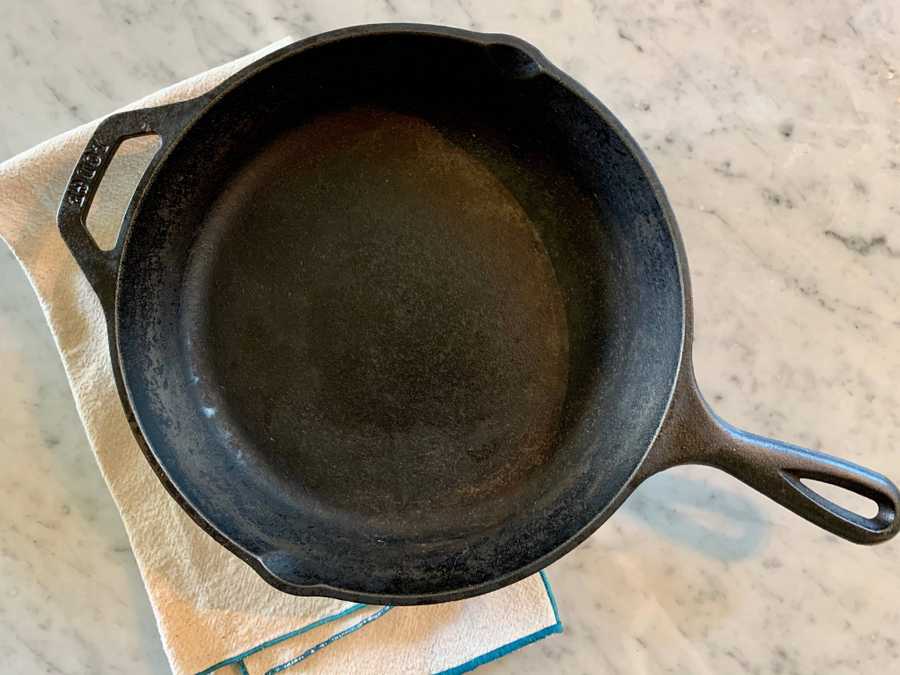 Cast iron skillet on a cloth napkin.