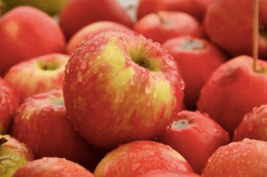 Apples covered in water droplets