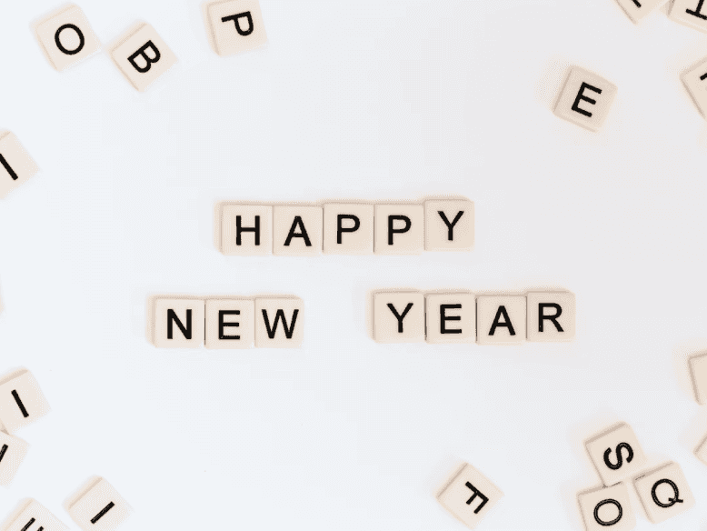 Scrabble tiles spelling out "Happy New Year"