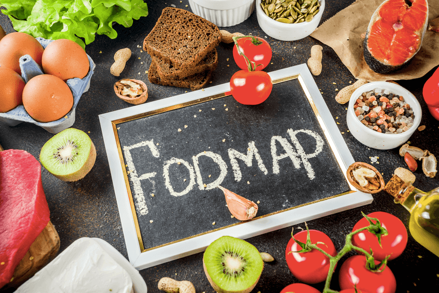 Assorted foods with chalkboard reading 'fodmap'