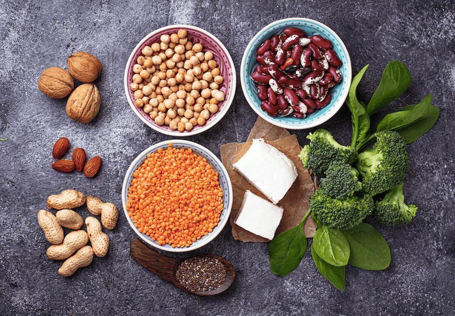 nuts, lentils, and tofu on a gray surface