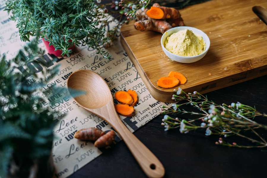 Ground turmeric in a small bowl on a table