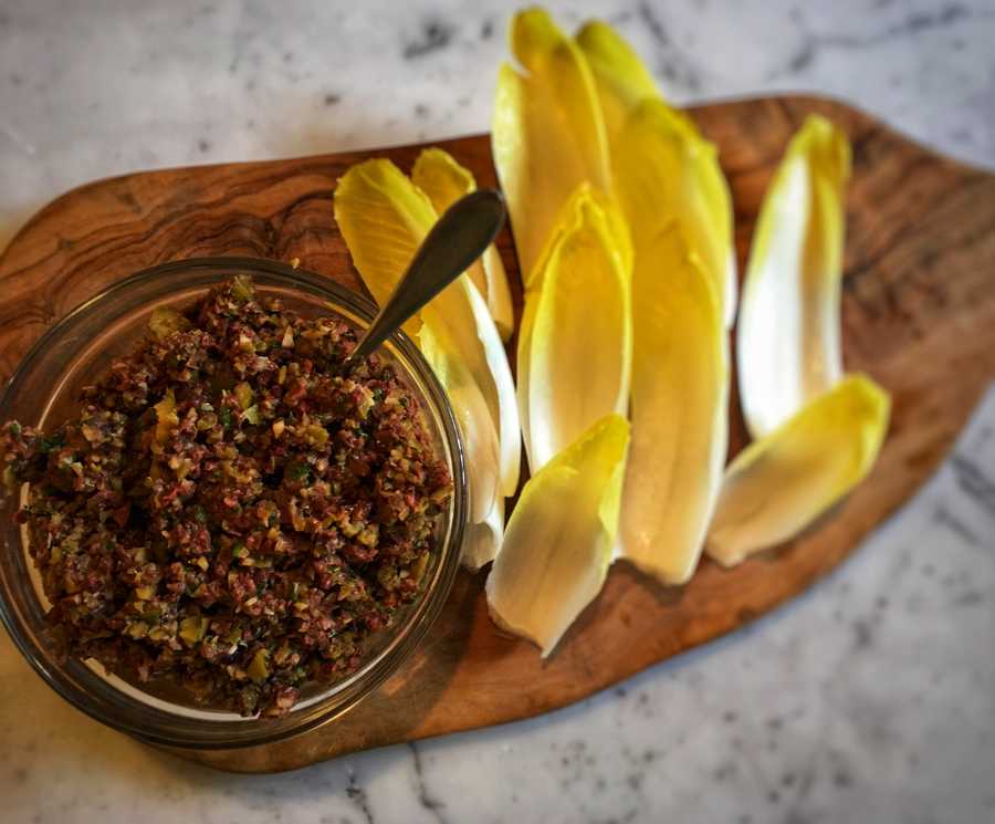 Homemade olive anchovy tapenade in a bowl