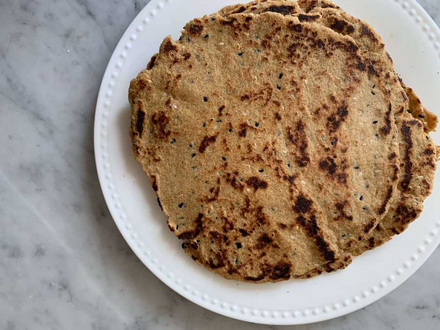 Flaxseed flatbreads on a white plate.