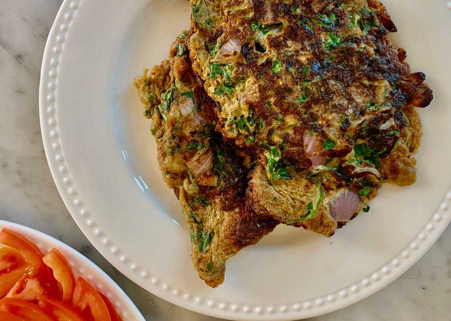 Parsley omelets on a white plate