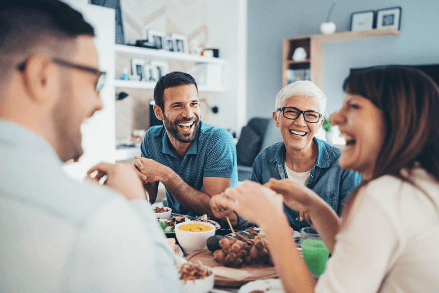 Multigenerational family eating together