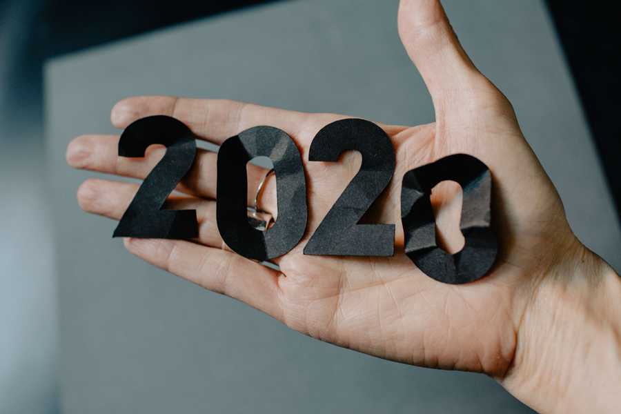 Open hand holding paper 2020 cut outs