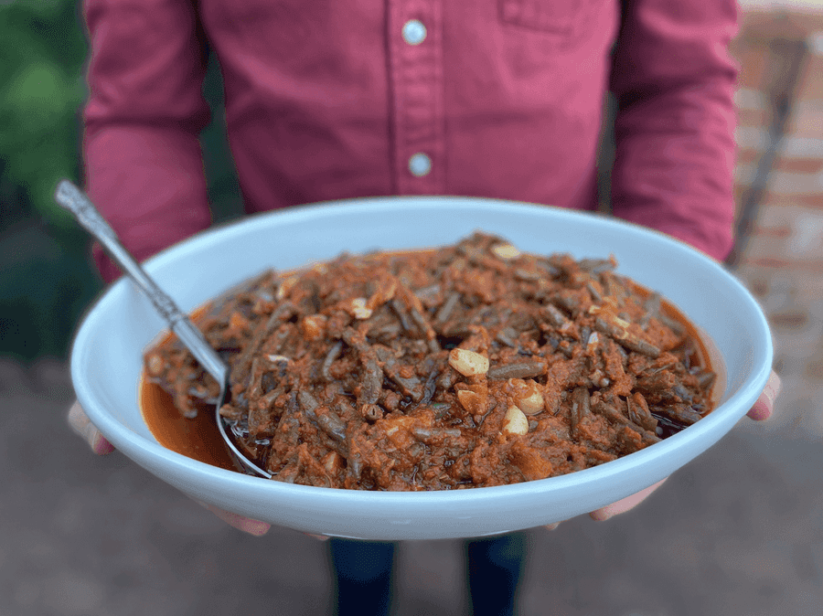 Bowl of green beans in tomato sauce