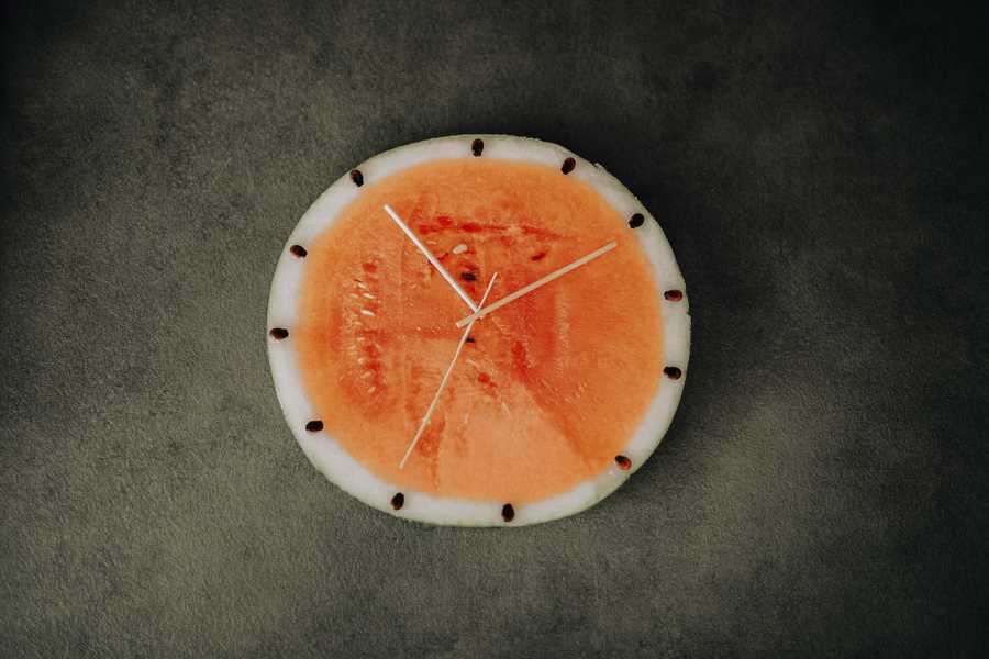 Section of watermelon set up as a clock face