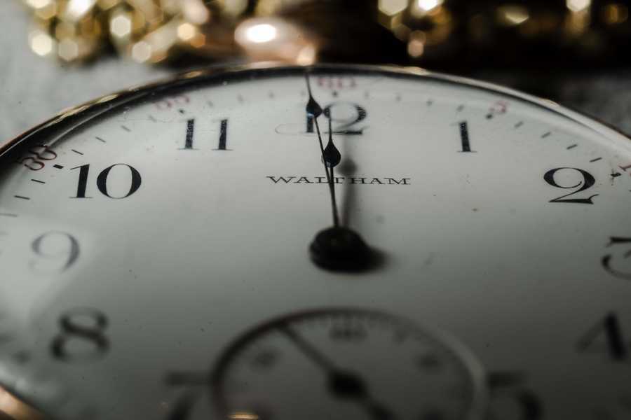 Face of a clock showing twelve o'clock